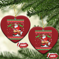 Red heart-shaped Christmas ornaments with a Santa chimney scene and gold strings