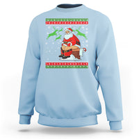 Light blue crewneck sweatshirt with Santa cartoon and festive holiday stripe graphic