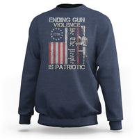 Navy crewneck sweatshirt with patriotic gun-violence graphic and text