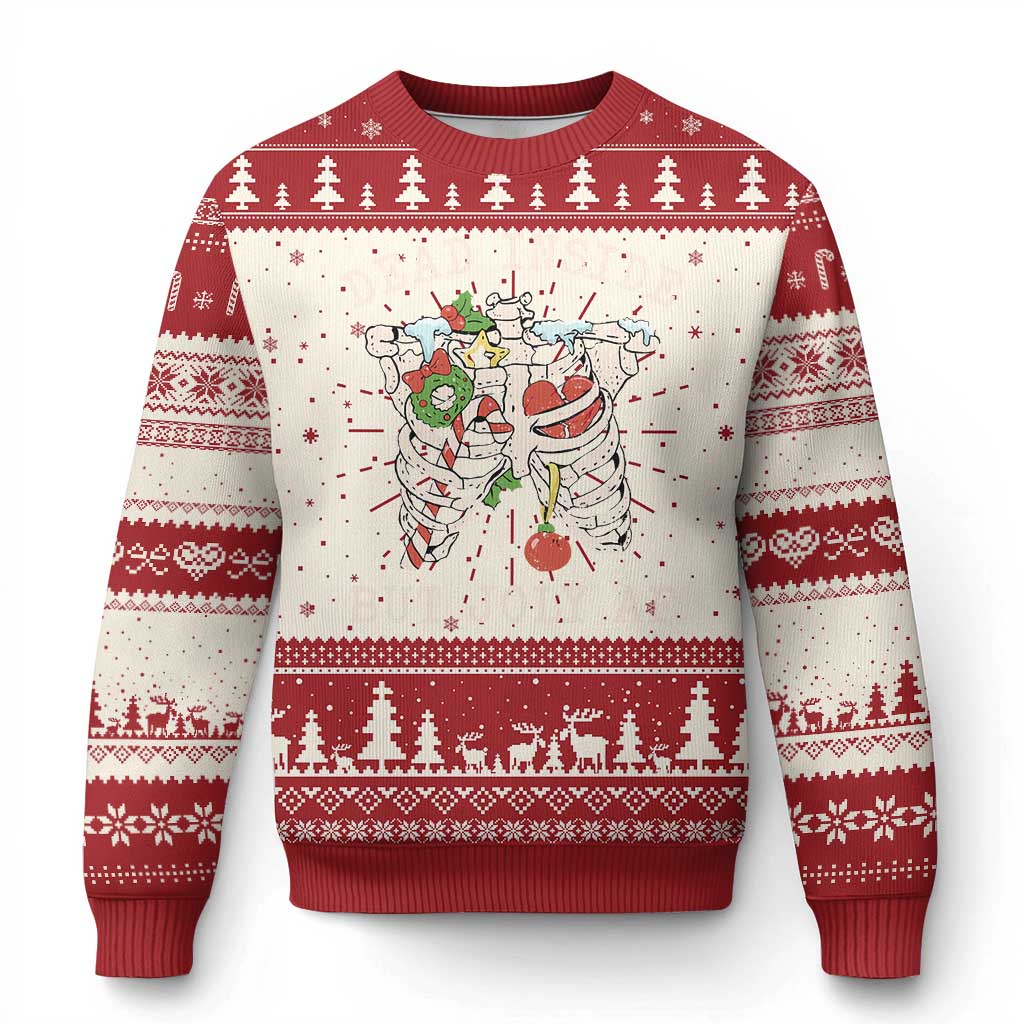 Red and cream Christmas sweater with snowflake patterns and skeleton graphic on front.