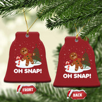 Two red bell-shaped “OH SNAP!” gingerbread ornaments with gold cords and front/back tags