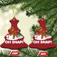 Two red tree-shaped “OH SNAP!” gingerbread ornaments hanging from gold cords with front/back tags