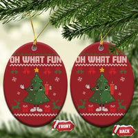 Two red oval Christmas ornaments with "Oh What Fun" and cartoon Christmas tree