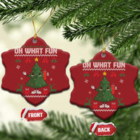 Two red bell-shaped ornaments with "Oh What Fun" and cartoon Christmas tree design