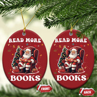 Two red round Christmas ornaments hanging together with Santa reading “READ MORE BOOKS”