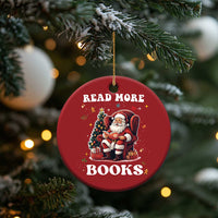 Red round Christmas ornament hanging on a tree with Santa and “READ MORE BOOKS”