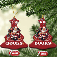Two red bell-shaped Christmas ornaments with “DM” visible on top and Santa reading “BOOKS”