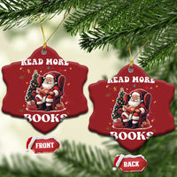 Two red heart-shaped Christmas ornaments on a tree with Santa and “READ MORE BOOKS”