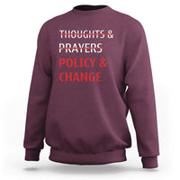 Maroon crewneck sweatshirt with red 'Thoughts & Prayers Policy & Change' print