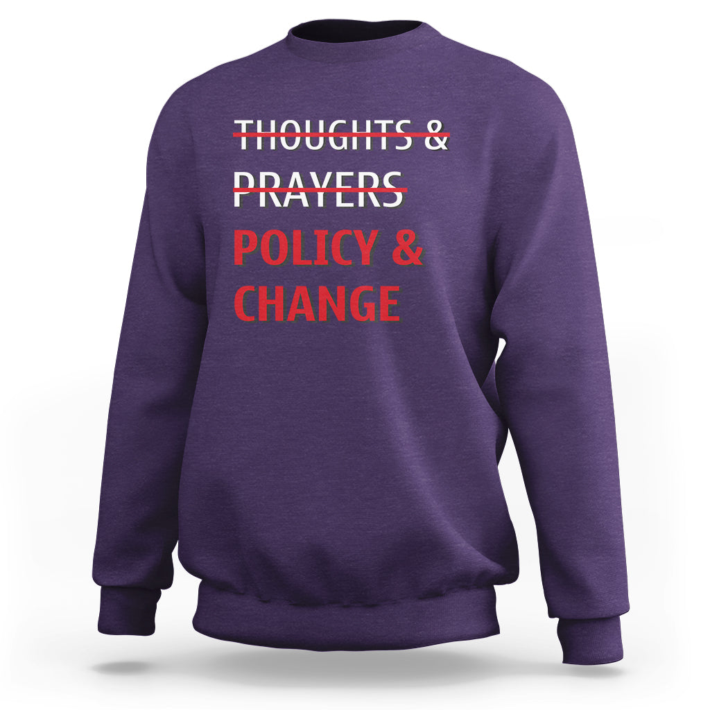 Purple crewneck sweatshirt with red 'Thoughts & Prayers Policy & Change' print