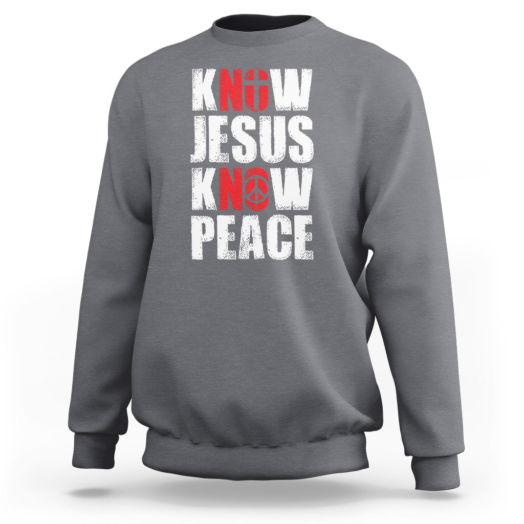 Charcoal sweatshirt with 'KNOW JESUS KNOW PEACE' graphic in white/red text.