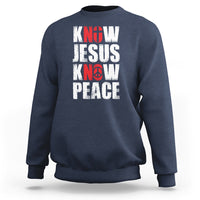 Navy sweatshirt with 'KNOW JESUS KNOW PEACE' graphic in white/red text.