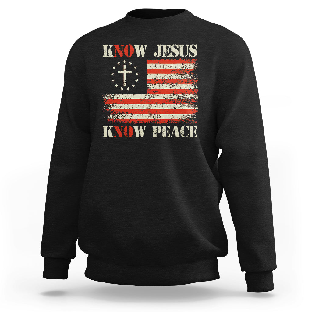 Black crewneck sweatshirt with Know Jesus cross and Know Peace American flag graphic