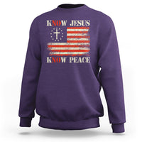 Purple crewneck sweatshirt with Know Jesus cross and Know Peace American flag graphic