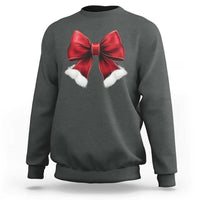 Dark heather crewneck sweatshirt with red bow and white pom accents on chest