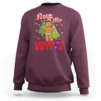Maroon crewneck sweatshirt with gingerbread cookie graphic and festive text