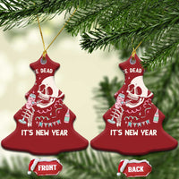 Two red Christmas tree-shaped ornaments with white skeleton graphic and “It’s New Year”