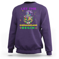 Purple crewneck sweatshirt with colorful Mardi Gras mask graphic and “LET THE SHENANIGANS BEGIN”.