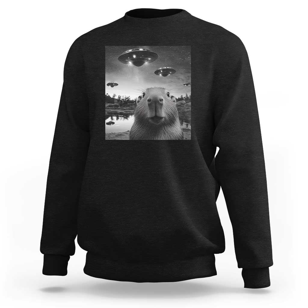 Black crewneck sweatshirt with capybara graphic featuring UFO-style lights