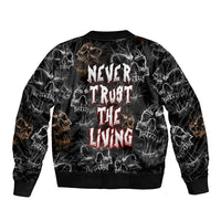 Black bomber jacket with skull print and Never Trust The Living back graphic