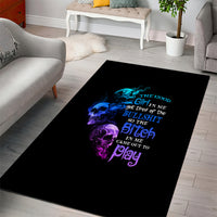 Black area rug with multicolor skull and quote graphic, rectangular design