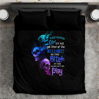 Black bedding set with centered blue/purple skull quote print and two pillowcases