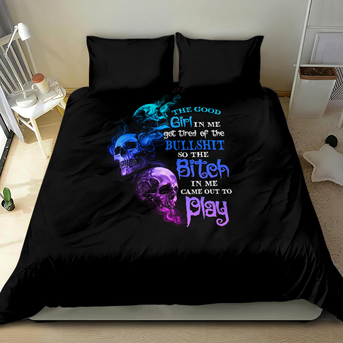 Black bedding set with blue/purple skull quote graphic on duvet and two pillows