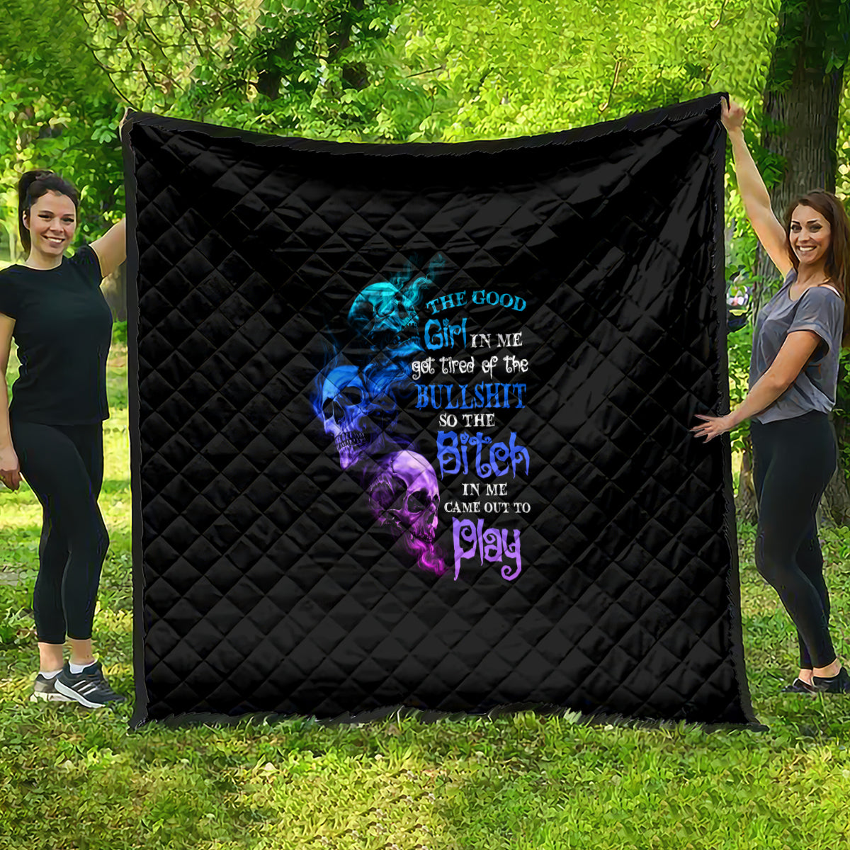 Black quilt with multicolor skull graphic, diamond quilting, large wall-hanging size