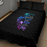 Black quilt bed set with colorful graphic center panel and matching quilted pillows