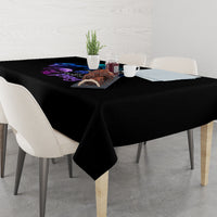 Black tablecloth over rectangular dining table with hanging corner