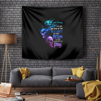 Black tapestry with centered diagonal blue and purple skull artwork and quote text