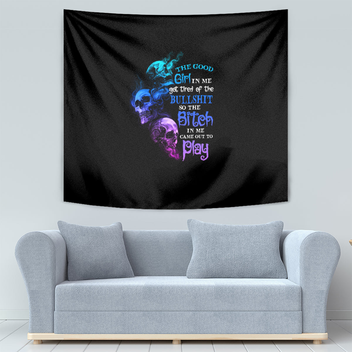 Black tapestry with blue and violet skull illustration and bold "bitch" lettering