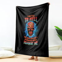 Black skull graphic blanket with blue lightning and multicolor text, hanging vertically