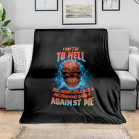 Black skull graphic throw blanket with blue lightning and bold multicolor slogan, draped on sofa