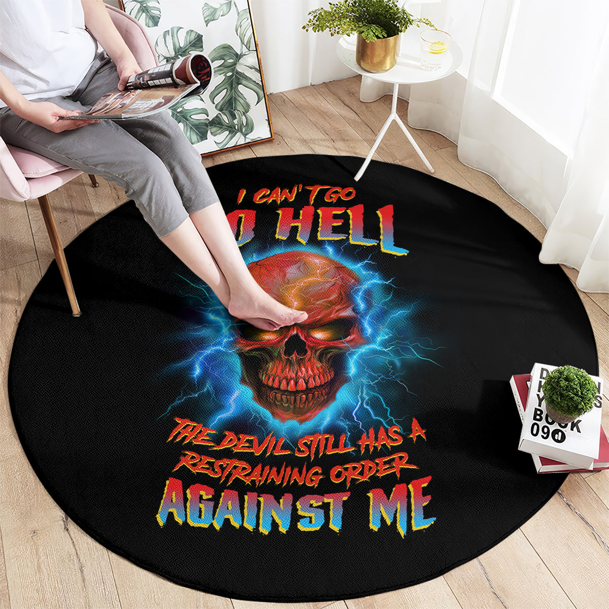 Black round carpet with skull graphic, blue lightning, and bold 'AGAINST ME' text