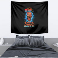 Black tapestry with skull graphic, blue flames, and colorful text, draped on wall