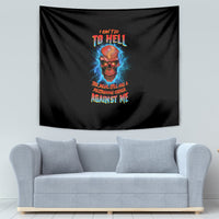 Black tapestry with skull graphic and colorful text, above light gray sofa