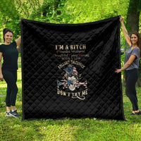 Black quilt blanket with diamond stitching and colorful skull graphic on center