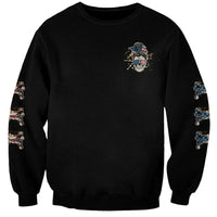 Unisex black crewneck sweatshirt with small multicolor skull graphic on chest