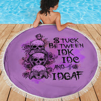 Round purple beach blanket with fringed edge, front skull-rose graphic and 'IDGAF' text