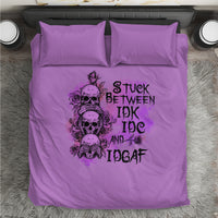Purple bedding set featuring a skull character graphic with stacked text, plus two pillows
