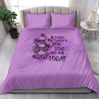 Purple bedding set with character skull graphic and bold text print, with two matching pillows