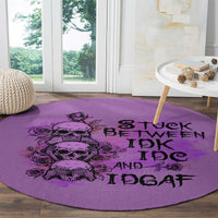 Purple round rug with black skull graphic and large 'IDK' and 'IDGAF' text