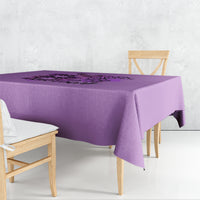 Purple tablecloth with black graphic text across the center.