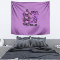 Purple tapestry with cartoon skull and roses cluster, and stacked distressed text design