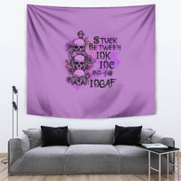 Purple tapestry with detailed cartoon skulls, roses, and stacked slogan text in dark ink