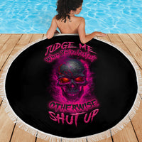 Round beach blanket with centered skull graphic, black fabric and white fringe edging