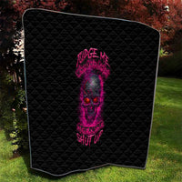 Black quilt with pink skull print and diamond quilting, framed like a blanket