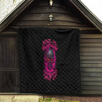 Black quilt with pink skull artwork and diamond stitch quilting, hanging on wall