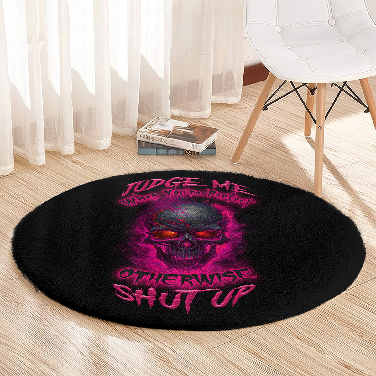 Black round carpet with purple skull design and “Judge Me” neon-style slogan